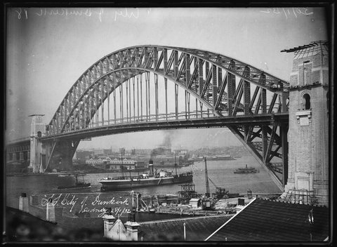 Glass plate negative of Ellerman’s City Line’s, SS ‘City of Dunkirk’, freighter passing under Sydney Harbour Bridge 28 January 1932, 1928
